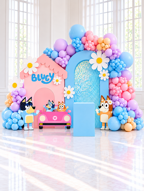 Décor de fête d'enfant avec maison rose, chiots découpés, marguerites blanches et guirlande de ballons en quatre couleurs